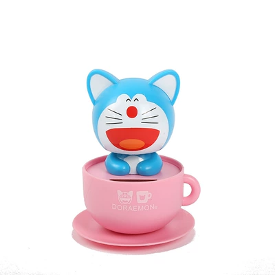 Car ornaments — cartoon doll solar car