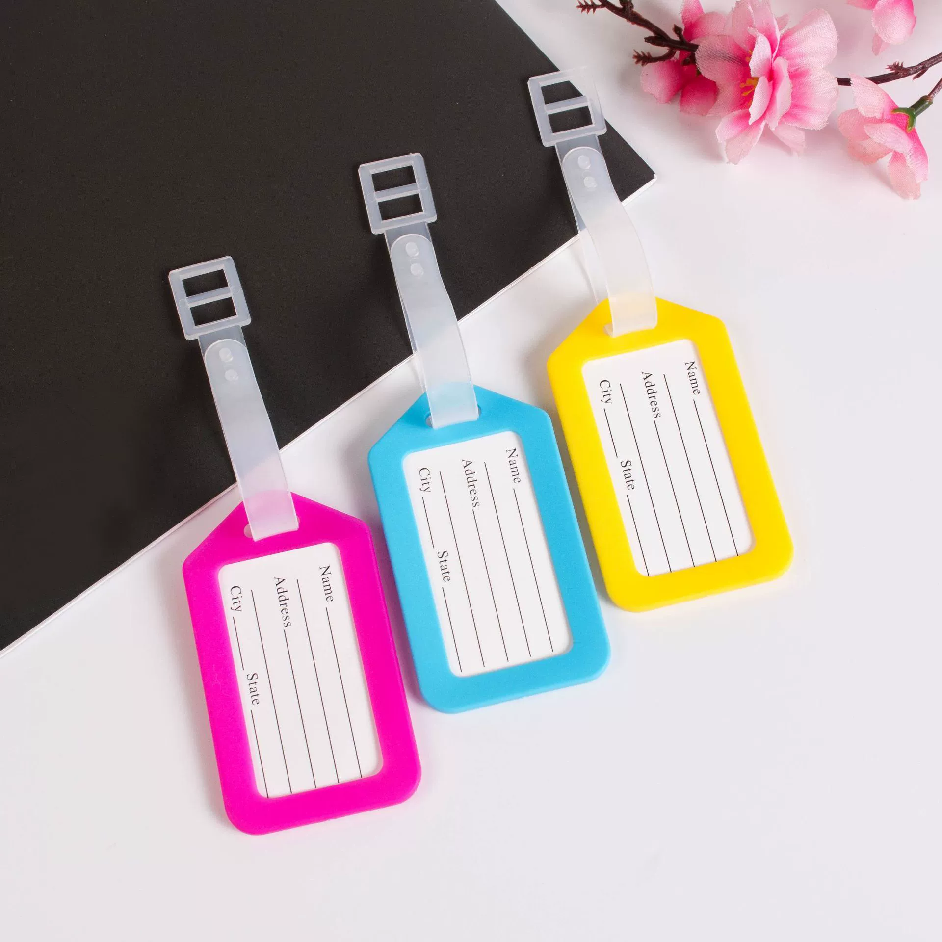 Plastic luggage tag, suitcase, airplane