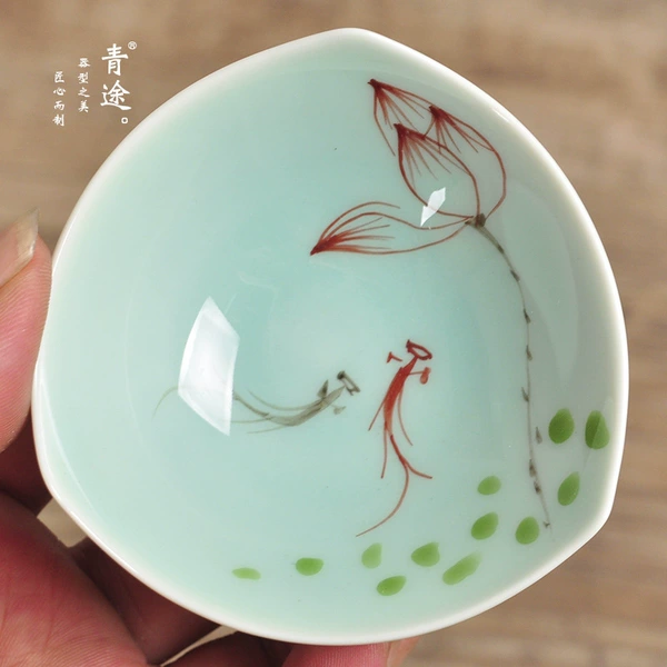 Triangular small cup fish playing with lotus