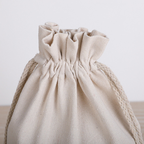 In-stock cloth rice bags: 5-pound millet bags, 10-pound rice packaging bags, and bulk wholesale canvas flour bags with drawstring closures.