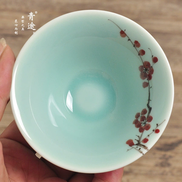 Red plum in bamboo hat cup