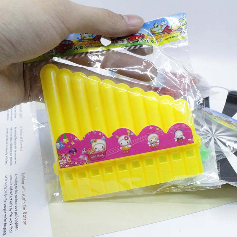 Los niños de dibujos animados de color caramelo respetuoso del medio ambiente boca de plástico 10 hoyos armónica música infantil educación temprana jugando juguetes de instrumentos musicales