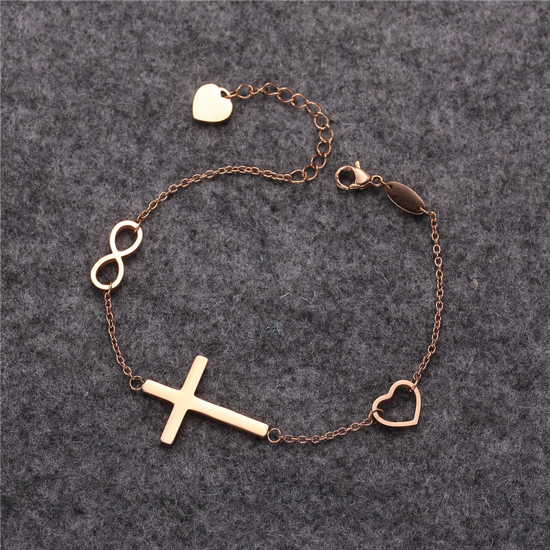 Europe and the United States cross-border fashion creative Cross 8-character peach heart pendant titanium steel bracelet Source manufacturers wholesale