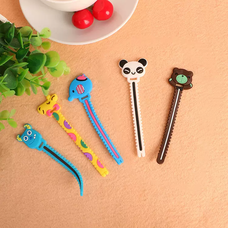 厂家批发卡通造型耳机绕线器彩色小锯齿绕线器定制数据线绕线器