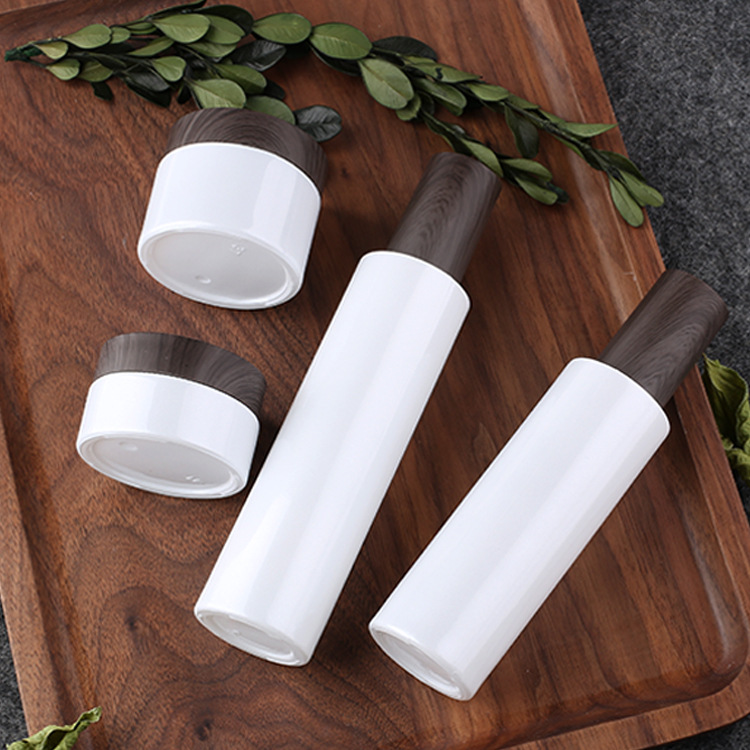 Conjunto de vidrio cosmético botella nacarado blanco botella de loción recta en stock botella de prensa de loción crema sub-botella