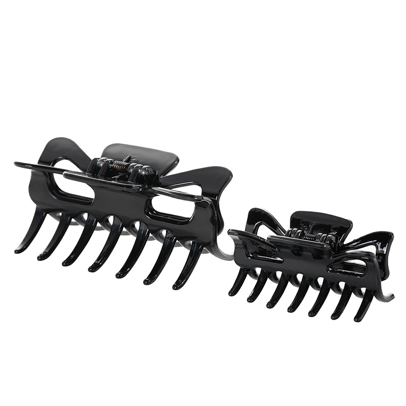 small black hairgrip with bow