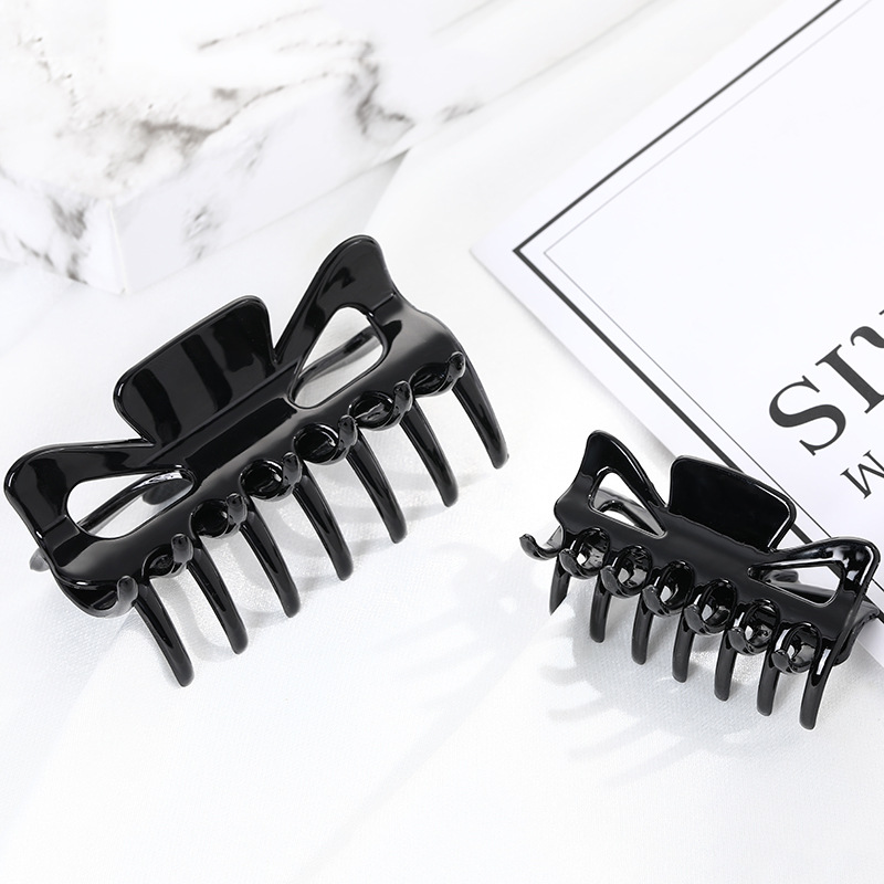 small black hairgrip with bow