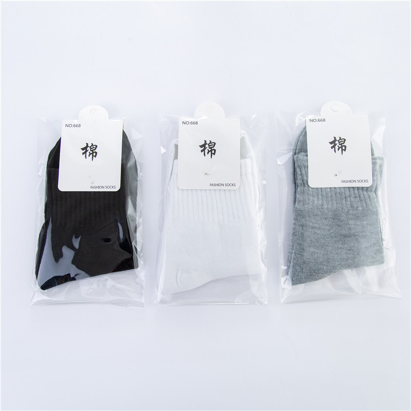 Medium tube solid color polyester cotton socks Tube Men's sports socks foot bath shop independent packaging men's socks manufacturers wholesale Medium tube solid color polyester cotton socks Tube Men's sports socks foot bath shop independent packaging men's socks manufacturers wholesale
