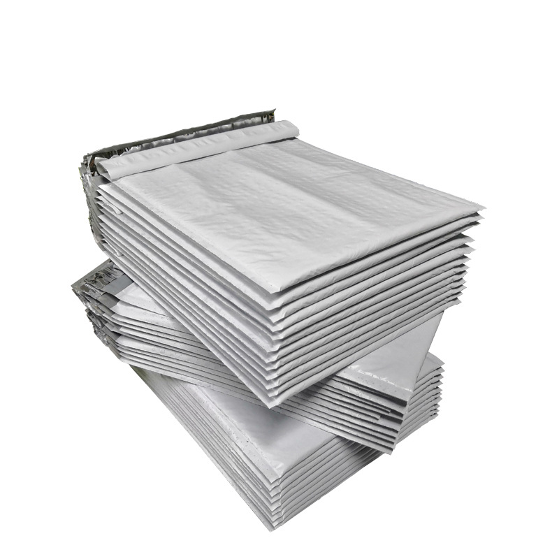 Bolsa de burbuja de película coextruida gris blanco transfronterizo Bolsa De sobre de embalaje expreso de espuma impermeable Shenzhen fábrica en stock al por mayor