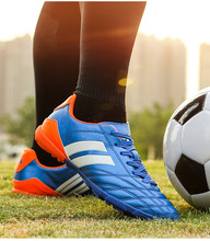 直銷新款兒童足球鞋男女低幫長釘橡膠草地球鞋運動訓練鞋一件代發
