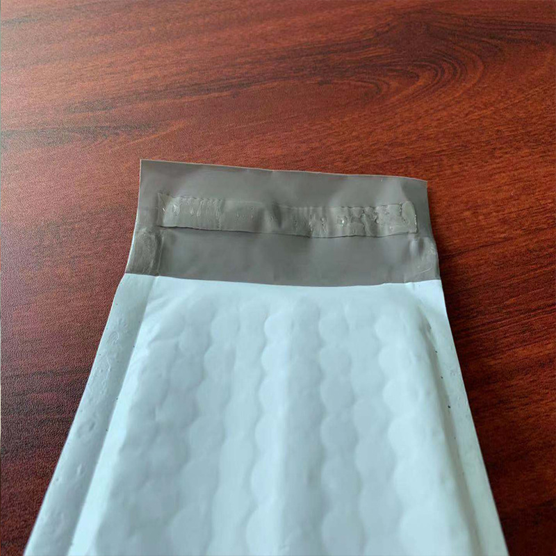 Bolsa de burbuja de película coextruida gris blanco transfronterizo Bolsa De sobre de embalaje expreso de espuma impermeable Shenzhen fábrica en stock al por mayor