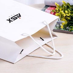 Perfume set with large, medium, and small white perfume bottles in a gift bag, suitable for wholesale with a tote bag