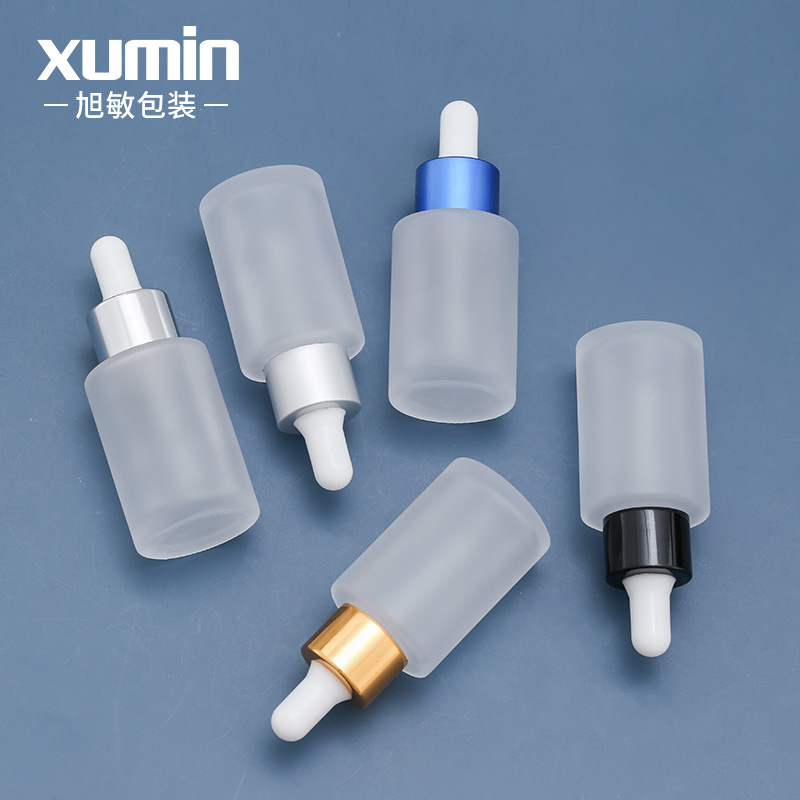 Xumin en stock envases cosméticos botella de líquido de vidrio botella de esencia esmerilada 30ML muestra botella cuentagotas sub-embalaje