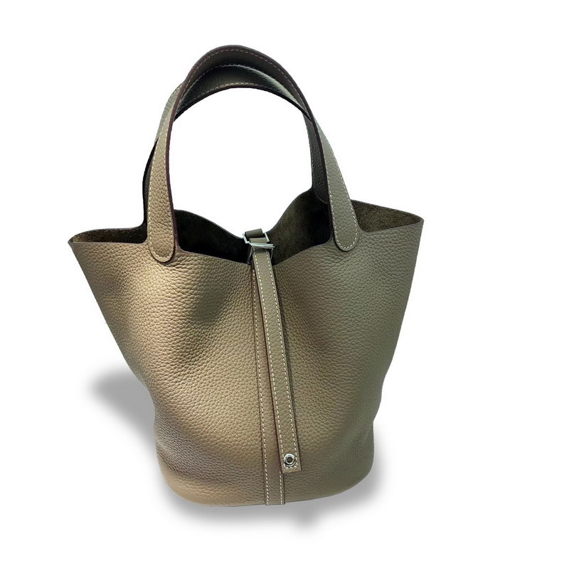 El nuevo bolso de cesta de verduras de marea de cuero togo de piel de vaca de capa superior 2025, bolso de cubo con cerradura de mano, bolso de cuero para mujer