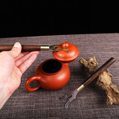 Manufacturer wholesale iron kettle clips, Kung Fu tea set accessories, dragon head kettle clip wholesale, black sandalwood iron kettle clip, engravable