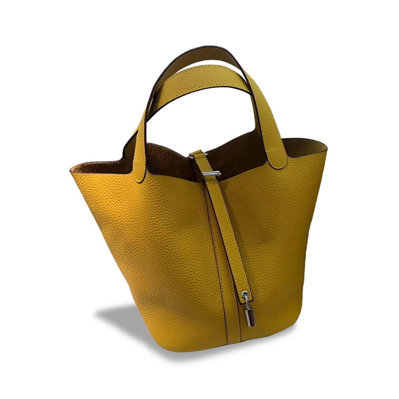 El nuevo bolso de cesta de verduras de marea de cuero togo de piel de vaca de capa superior 2025, bolso de cubo con cerradura de mano, bolso de cuero para mujer