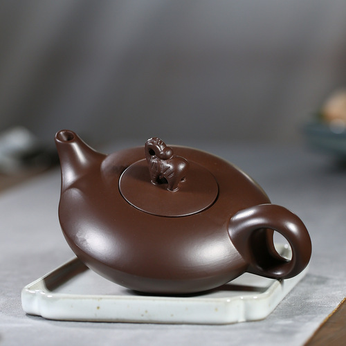 Order one purple clay elephant pot as a gift from the manufacturer, with the item being shipped directly from Yixing, featuring auspicious and lucky designs, and offering wholesale tea pots and tea sets.