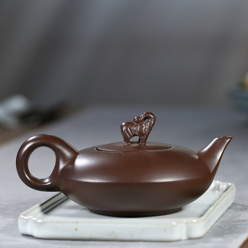 Order one purple clay elephant pot as a gift from the manufacturer, with the item being shipped directly from Yixing, featuring auspicious and lucky designs, and offering wholesale tea pots and tea sets.