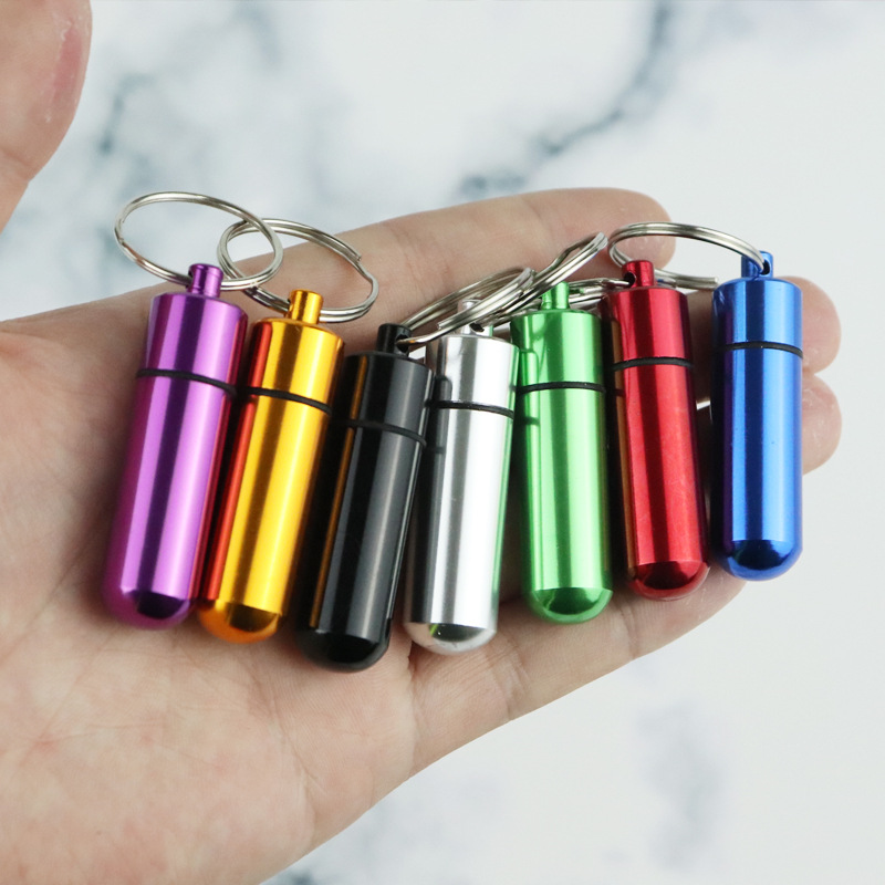Aleación de aluminio impermeable al aire libre sellado botella colgante píldora de primeros auxilios llavero adaptador de teléfono móvil almacenamiento almacén impermeable