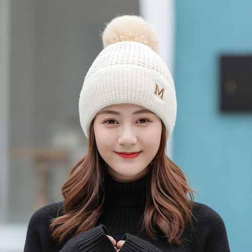Japanese new style M letter hat fashionable knitted hat for women Korean version winter plus velvet warm hat fur ball woolen hat