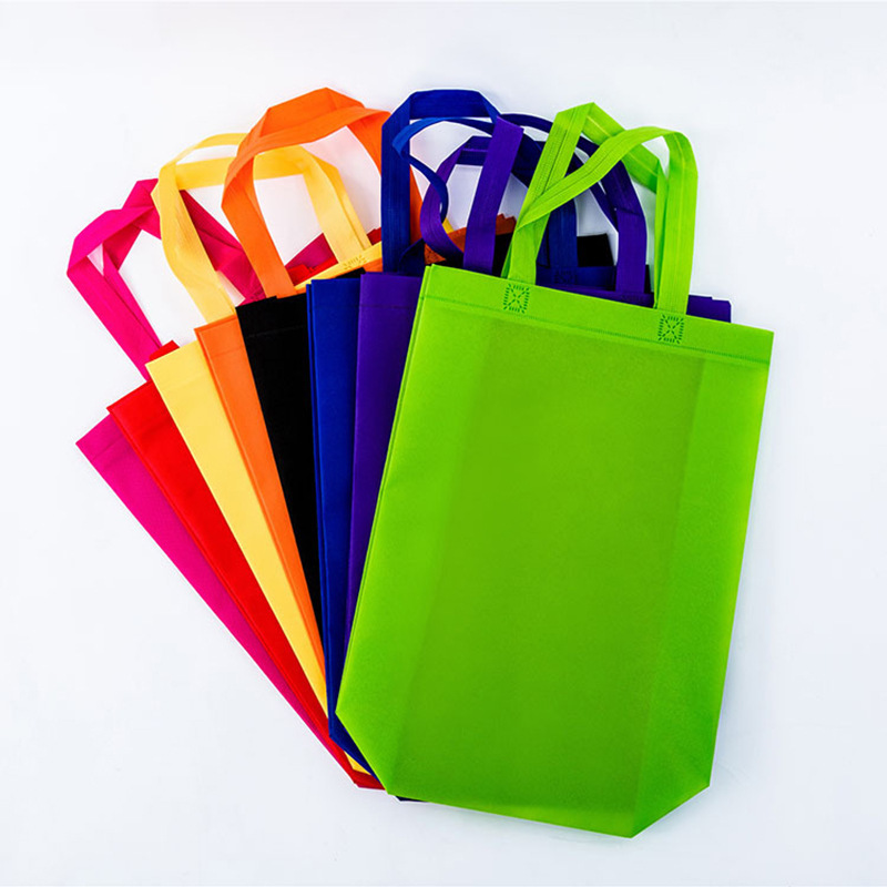 Bolsa de asas verde directa de fábrica bolsa de compras bolsa de chaleco bolsa de publicidad logotipo de película de color bolsa no tejida en stock