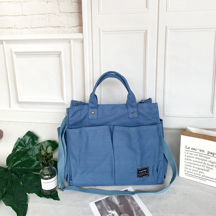 Nuevo estilo japonés bolsa de lona bolsa de mensajero de las mujeres de moda simple bolsa de tela estudiante bolso de lona casual