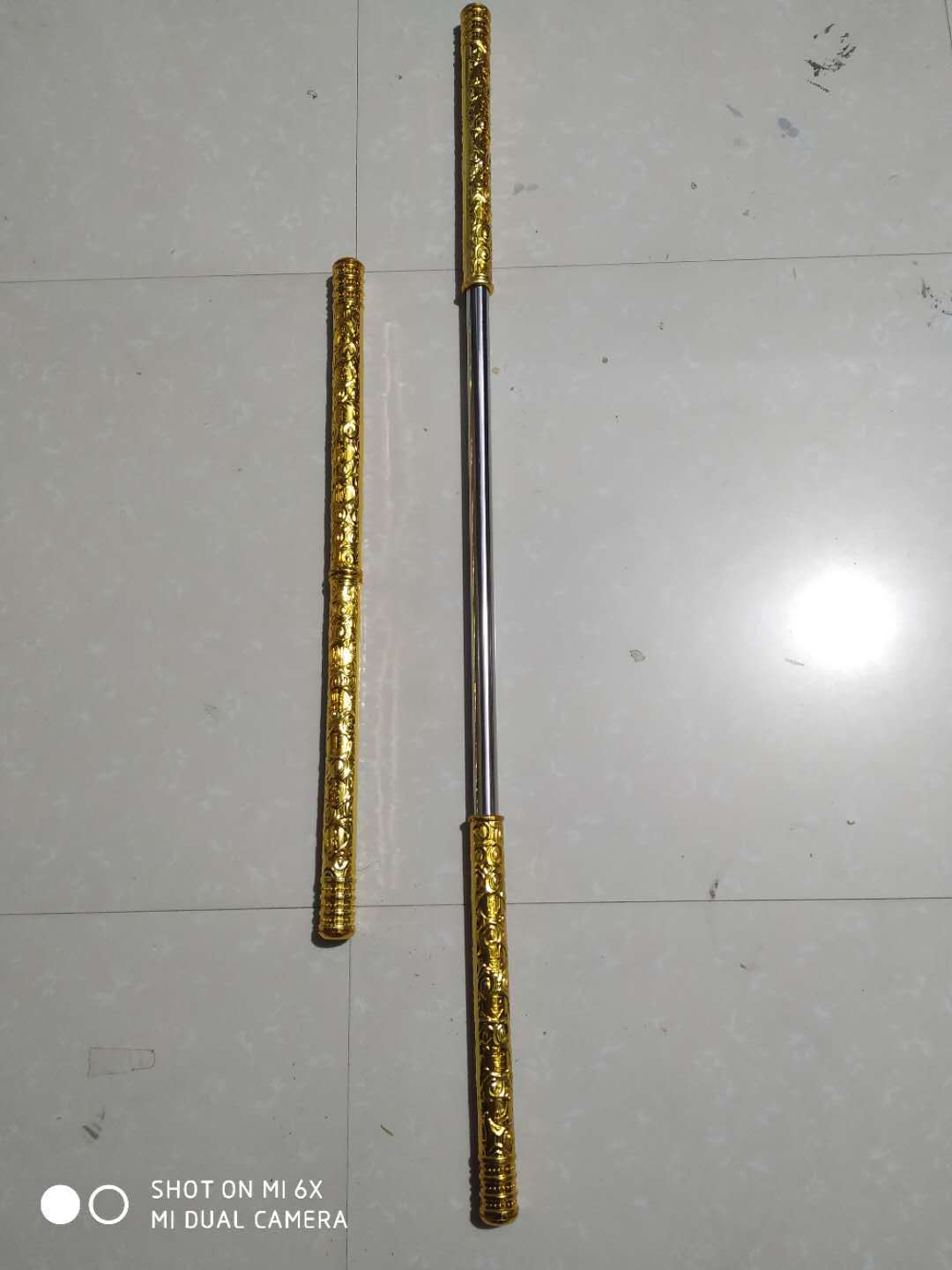 Gold cudgel automatic telescopic stainless steel Monkey King luminous telescopic gold cudgel children's toy stall scenic spot wholesale