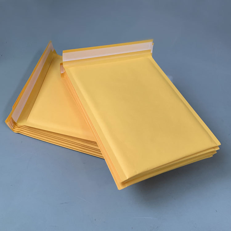 En stock amarillo Kraft bolsa de burbuja de papel bolsa de ropa burbuja engrosada expreso burbuja sobre bolsa de burbuja sobre