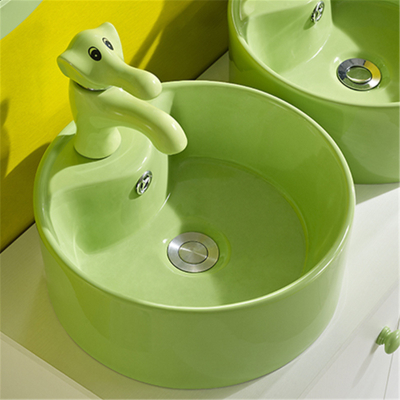 Lavabo de color para niños de jardín de infantes lavabo de cerámica tamaño pequeño lavabo para niños mesa redonda lavabo fabricante