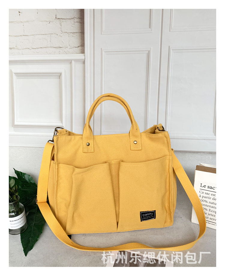 Nuevo estilo japonés bolsa de lona bolsa de mensajero de las mujeres de moda simple bolsa de tela estudiante bolso de lona casual