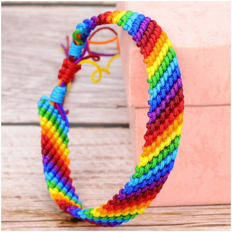 Factory wholesale European and American popular polyester thread men's and girls' colorful rope rainbow hand-woven bracelet