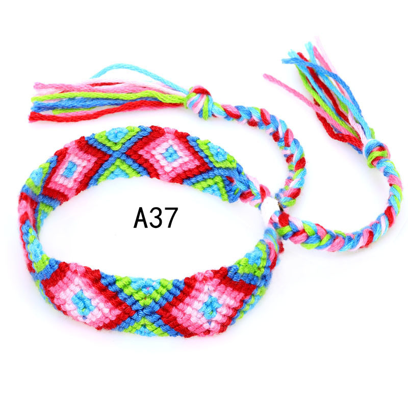 La Venta caliente europea y americana tejida pulsera Nepal estilo étnico tejido a mano Arco Iris Lucky amistad pulsera
