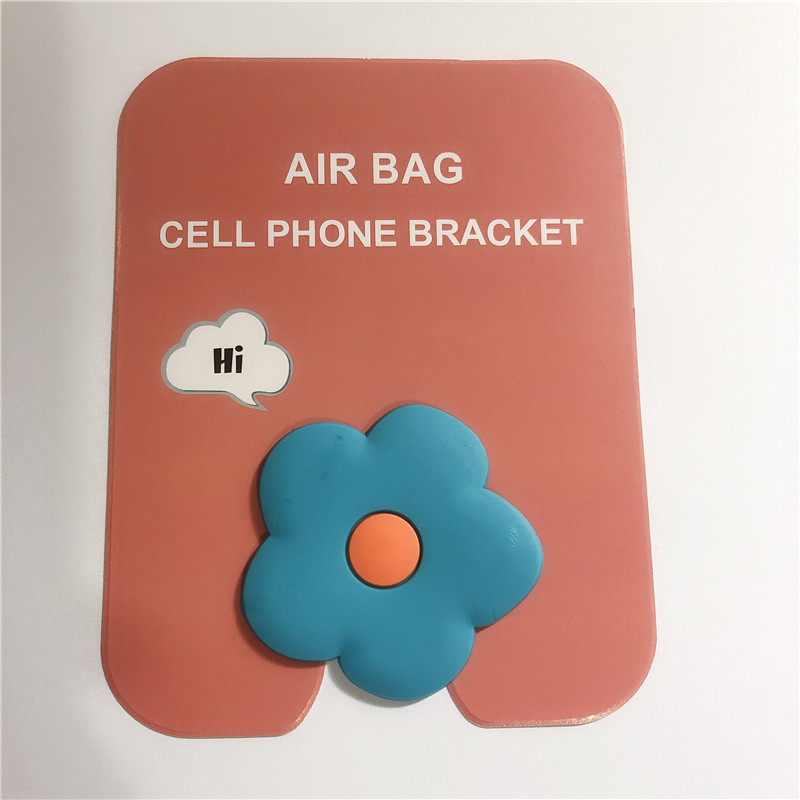 En stock al por mayor TikTok Cartoon creativo soporte de teléfono móvil puede soportar airbag soporte de teléfono móvil soporte de escritorio