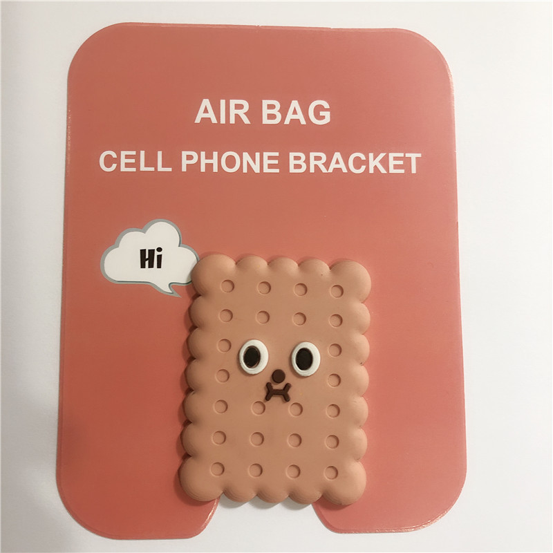 En stock al por mayor TikTok Cartoon creativo soporte de teléfono móvil puede soportar airbag soporte de teléfono móvil soporte de escritorio