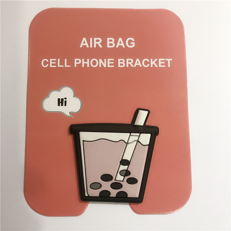 En stock al por mayor TikTok Cartoon creativo soporte de teléfono móvil puede soportar airbag soporte de teléfono móvil soporte de escritorio