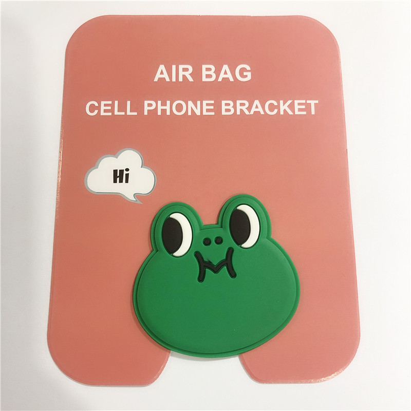 En stock al por mayor TikTok Cartoon creativo soporte de teléfono móvil puede soportar airbag soporte de teléfono móvil soporte de escritorio