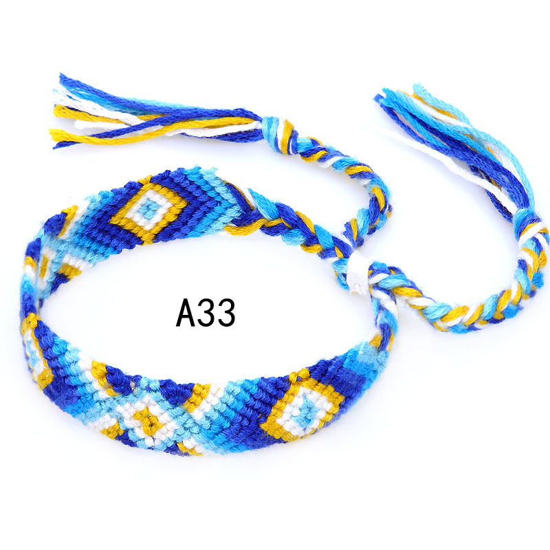 La Venta caliente europea y americana tejida pulsera Nepal estilo étnico tejido a mano Arco Iris Lucky amistad pulsera