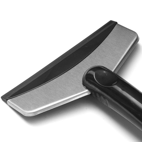 Stainless steel snow shovel for automobiles. Winter ice scraping tool that does not damage the glass and removes snow. Multifunctional defrosting and snow scraping tool.