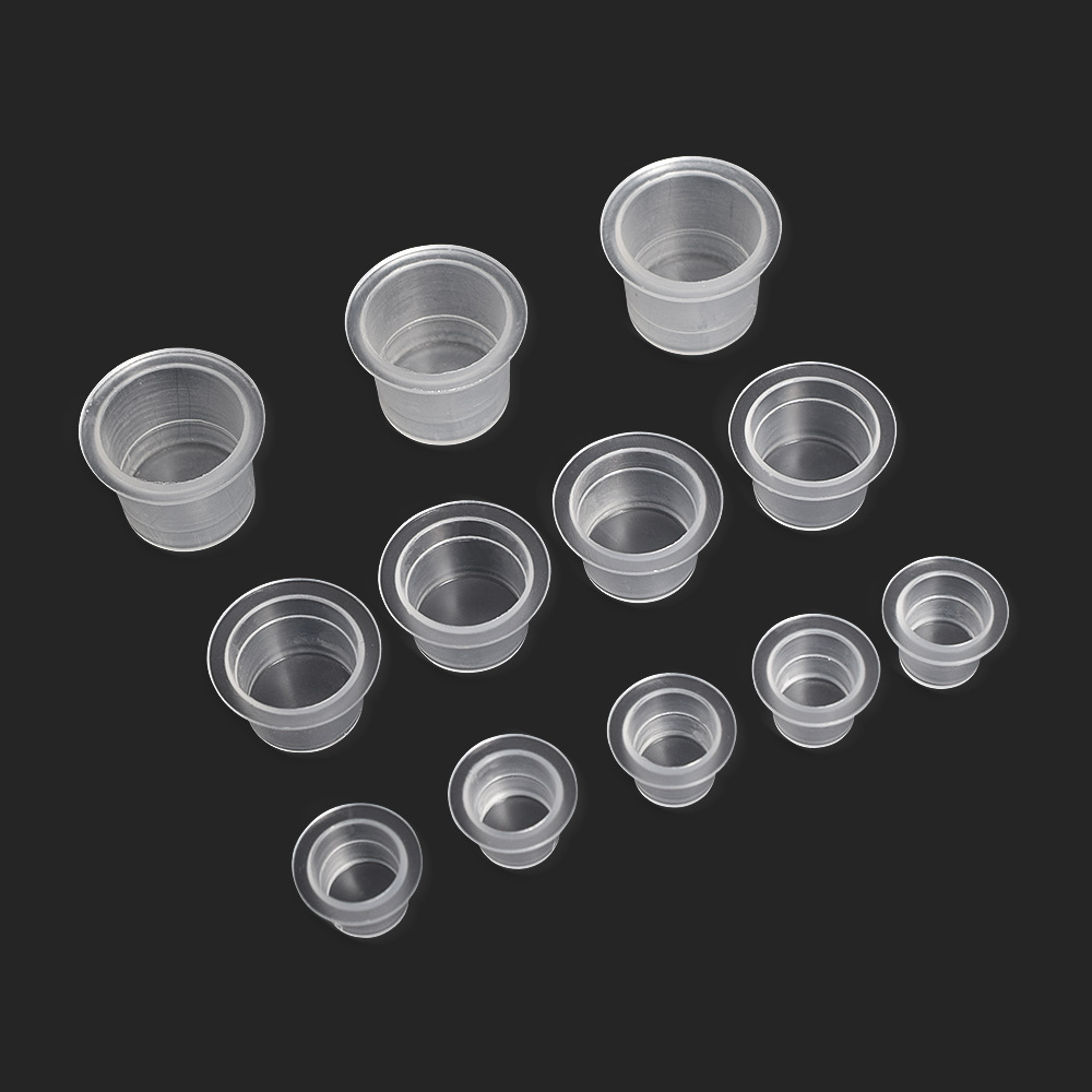 Tattoo ink cups, tattoo bases, colored pigment cups, tattoo supplies, tattoo materials. Approximately 100 pieces per pack.