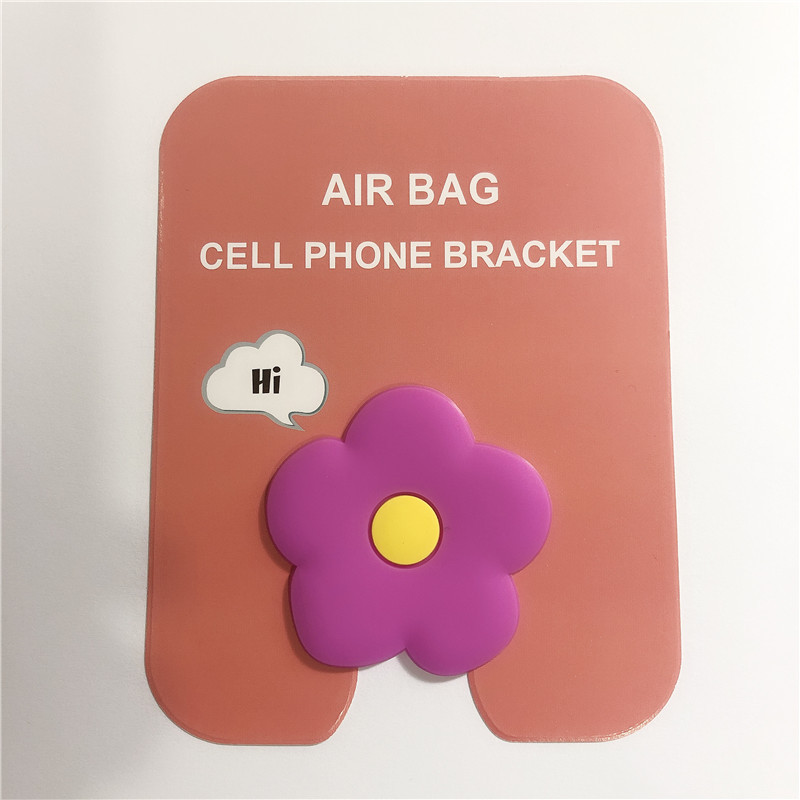 En stock al por mayor TikTok Cartoon creativo soporte de teléfono móvil puede soportar airbag soporte de teléfono móvil soporte de escritorio