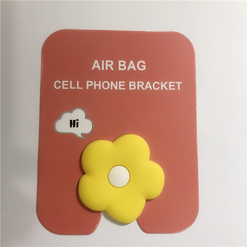 En stock al por mayor TikTok Cartoon creativo soporte de teléfono móvil puede soportar airbag soporte de teléfono móvil soporte de escritorio