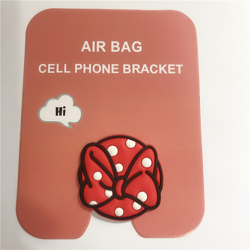 En stock al por mayor TikTok Cartoon creativo soporte de teléfono móvil puede soportar airbag soporte de teléfono móvil soporte de escritorio