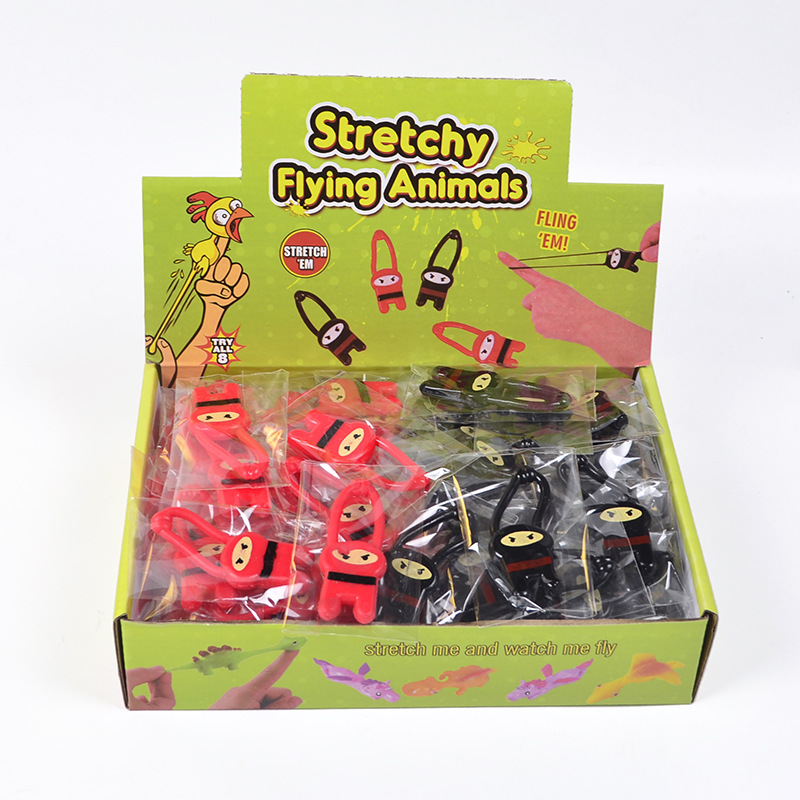 Suministro nuevo exótico TPR goma suave lanzador Ninja elástico pequeña figura juguete catapulta dedo animal