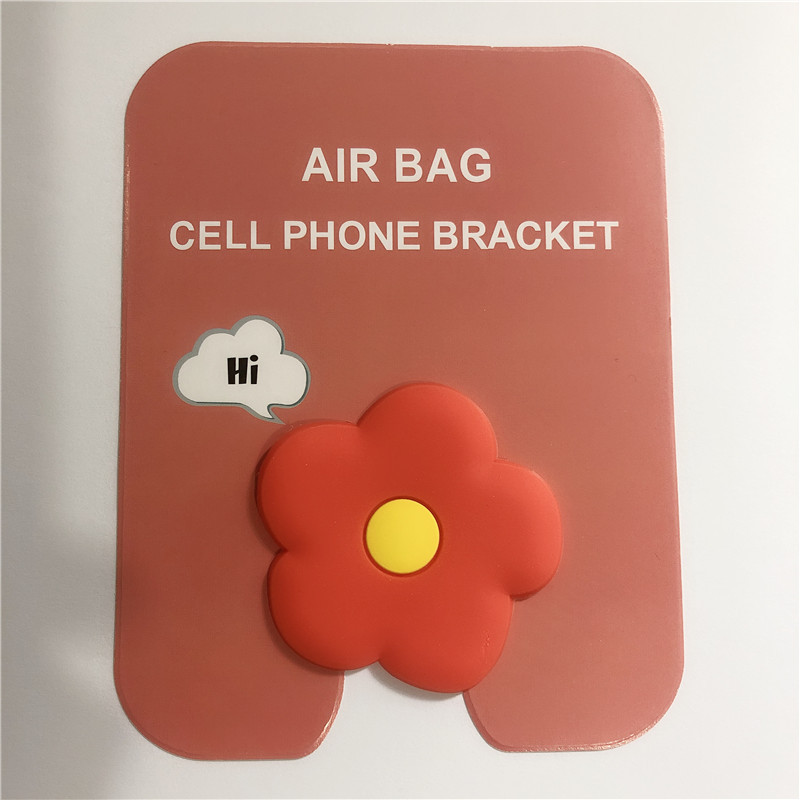 En stock al por mayor TikTok Cartoon creativo soporte de teléfono móvil puede soportar airbag soporte de teléfono móvil soporte de escritorio