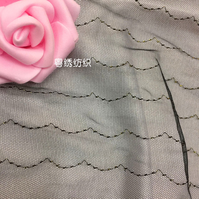 Fábrica directa malla de nylon jacquard seda oro onda hexagonal base tela los niños ropa