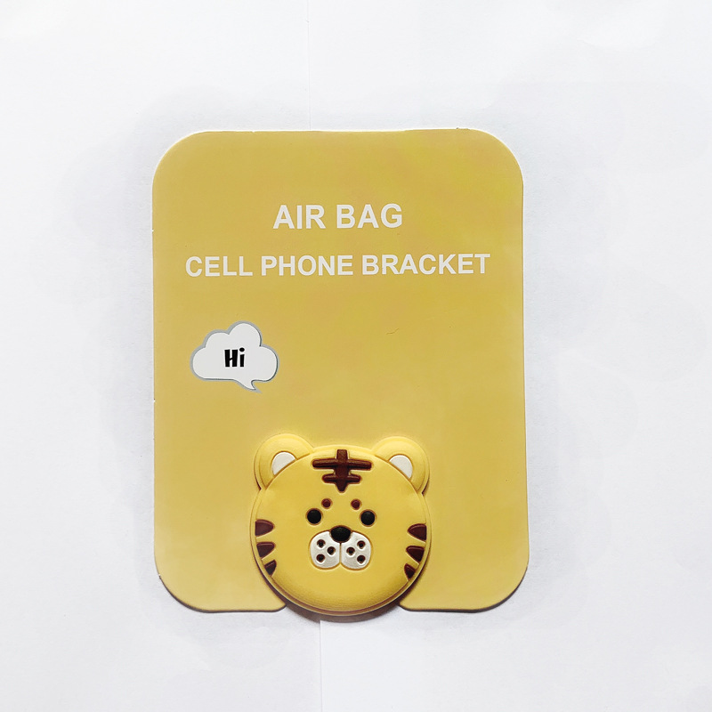 En stock al por mayor TikTok Cartoon creativo soporte de teléfono móvil puede soportar airbag soporte de teléfono móvil soporte de escritorio