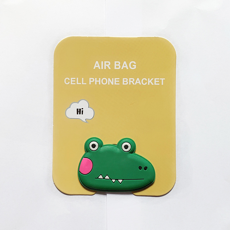 En stock al por mayor TikTok Cartoon creativo soporte de teléfono móvil puede soportar airbag soporte de teléfono móvil soporte de escritorio