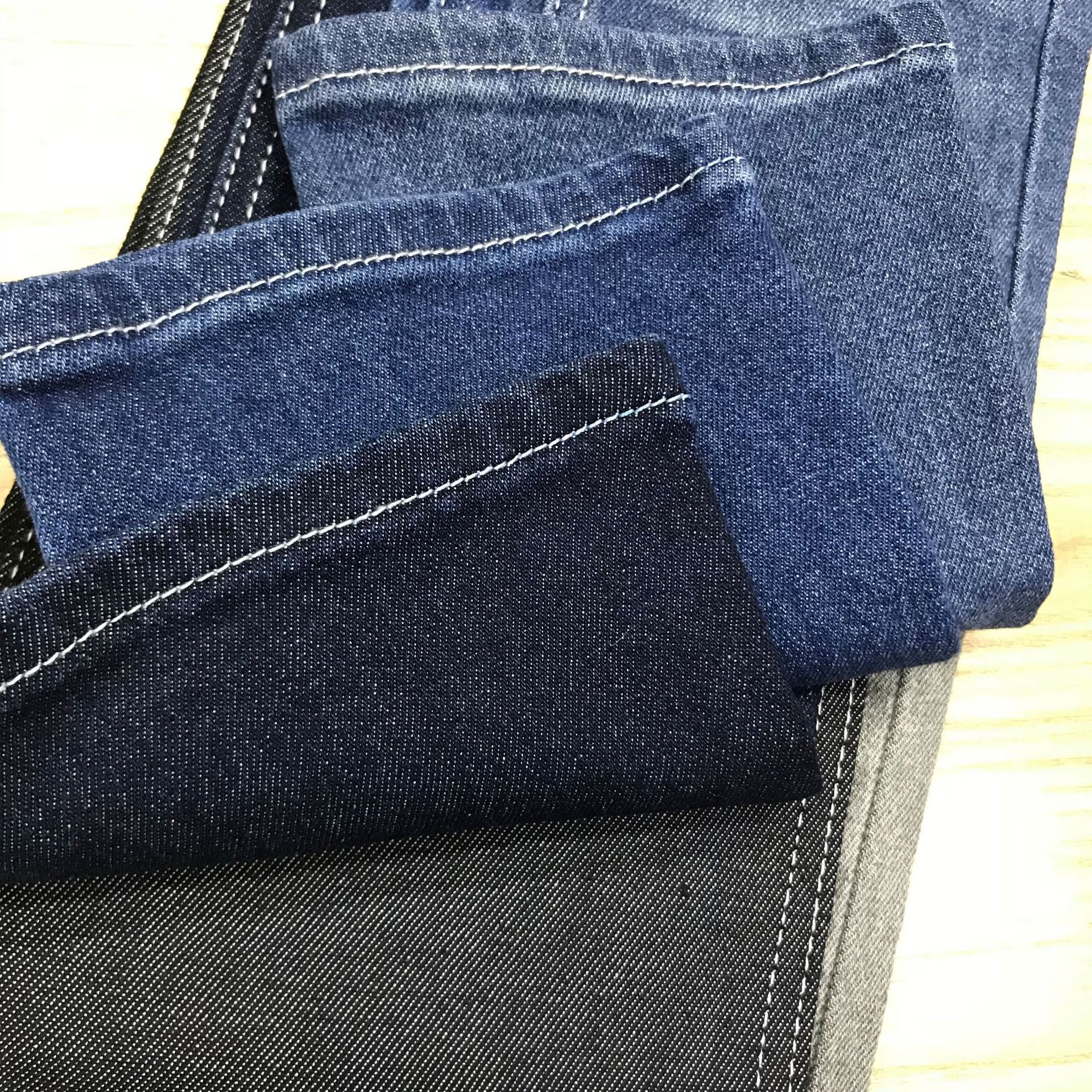 Moda tejido elástico de tela de mezclilla 10 piezas de Dios teñido elástico inferior doble Bud núcleo pura sarga Denim ventas directas de la fábrica