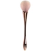 Wineglass contains rose, golden face blush, brush, pack