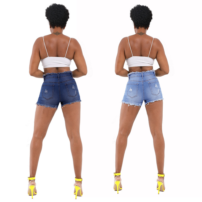 2023 primavera nuevo en stock al por mayor americano Amazon primavera y verano nuevo botón borla borde ropa de mujer Pantalones cortos de mezclilla